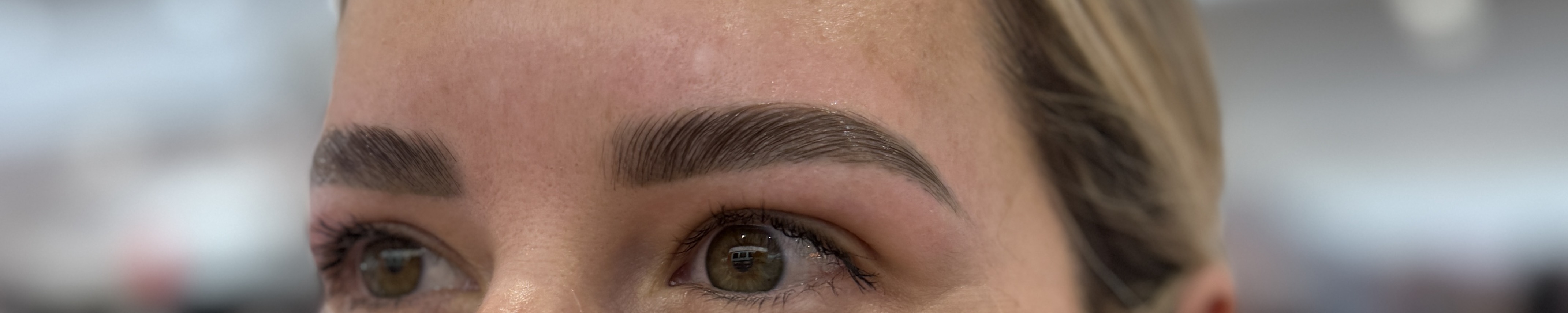 Completed brow shaping with both eyes visible
